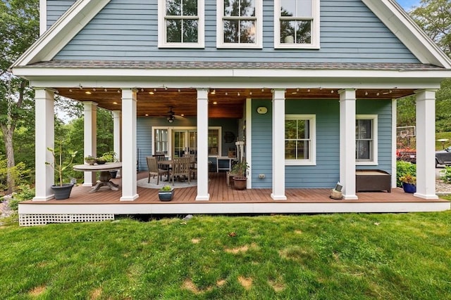 14 Reiling Pond Rd, Lincoln, MA 01773 - rear view of property featuring a yard, a ceiling fan, a shingled roof, and a wooden deck