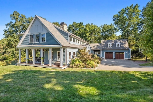 14 Reiling Pond Rd, Lincoln, MA 01773 - view of front of property featuring asphalt driveway, covered porch, a front yard, and a chimney