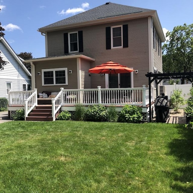 14 Highland St, Clinton, MA 01510 - rear view of property featuring a wooden deck, a yard, and a shingled roof