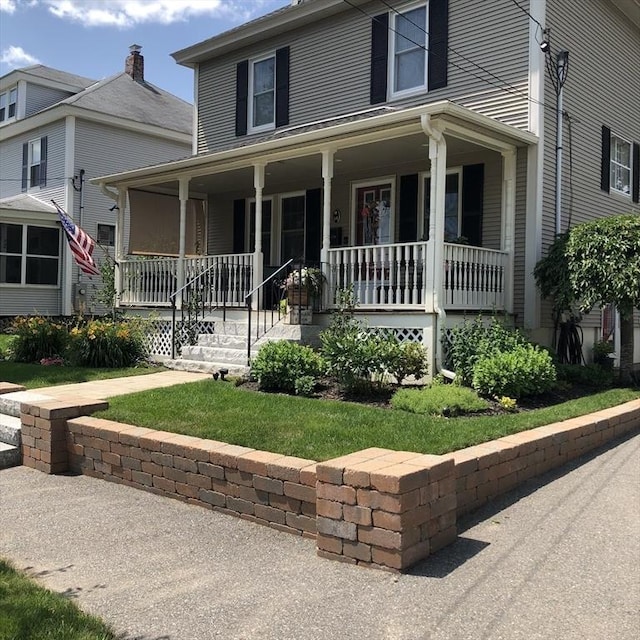 14 Highland St, Clinton, MA 01510 - view of front facade with a porch