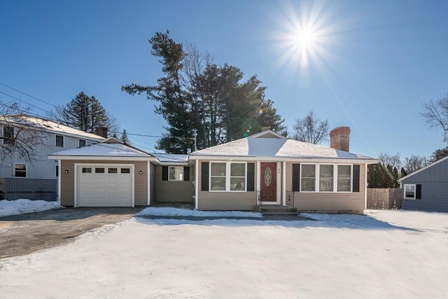 ranch-style house featuring a garage