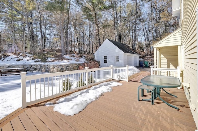 snow covered deck with an outbuilding