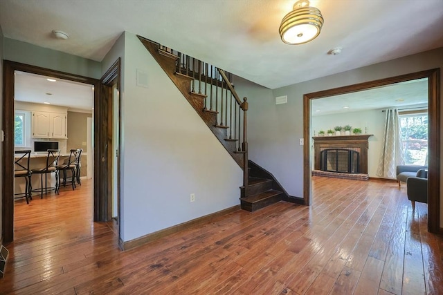 5 Windsor Rd, Lynnfield, MA 01940 - living room featuring a fireplace, stairs, and hardwood / wood-style floors