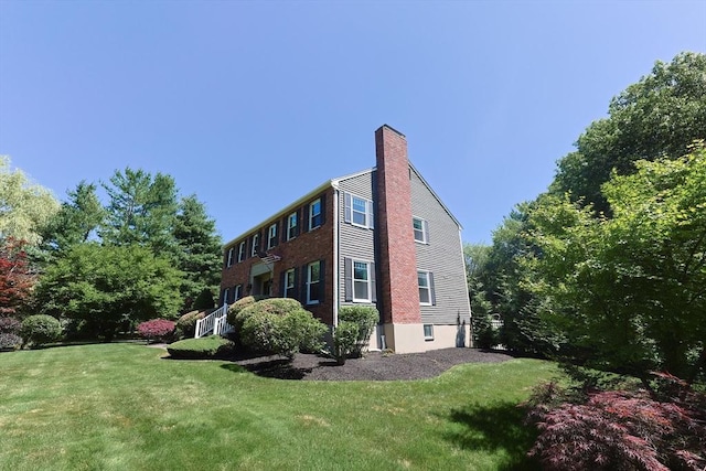5 Windsor Rd, Lynnfield, MA 01940 - view of property exterior featuring a chimney and a yard