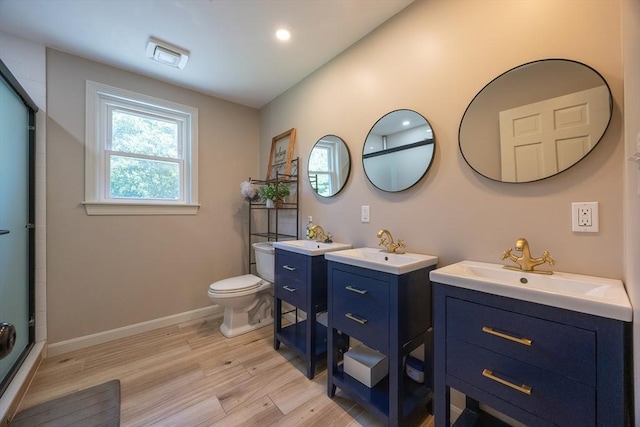 5 Windsor Rd, Lynnfield, MA 01940 - full bathroom featuring wood finished floors, an enclosed shower, two vanities, and recessed lighting
