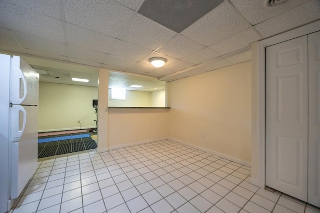 5 Windsor Rd, Lynnfield, MA 01940 - finished basement with freestanding refrigerator and a paneled ceiling