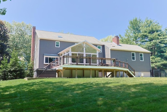5 Windsor Rd, Lynnfield, MA 01940 - back of house featuring stairs, a chimney, a deck, and a lawn