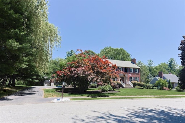 5 Windsor Rd, Lynnfield, MA 01940 - colonial home featuring a front yard and a chimney