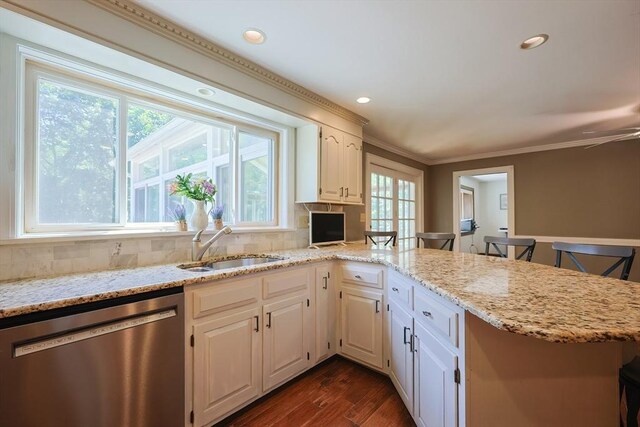 5 Windsor Rd, Lynnfield, MA 01940 - kitchen featuring dishwasher, a peninsula, decorative backsplash, dark wood finished floors, and crown molding