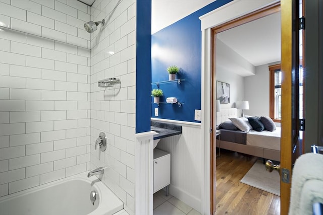 432 Norfolk St Unit 3B, Somerville, MA 02143 - full bathroom featuring  shower combination, ensuite bath, a wainscoted wall, wood finished floors, and vanity
