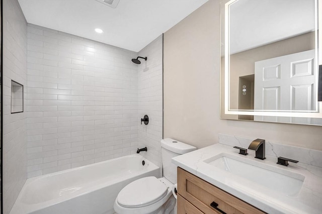 bathroom with toilet, shower / tub combination, and vanity