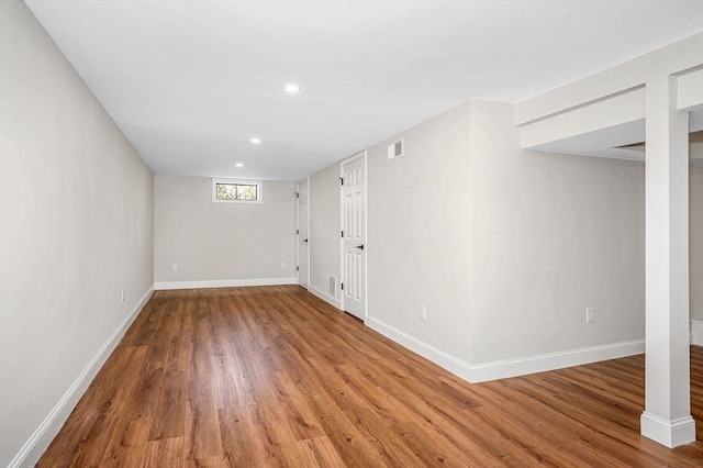 basement with recessed lighting, baseboards, and wood finished floors