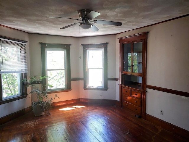 61-63 Grant St, Somerville, MA 02145 - empty room featuring wood-type flooring, a ceiling fan, crown molding, and baseboards