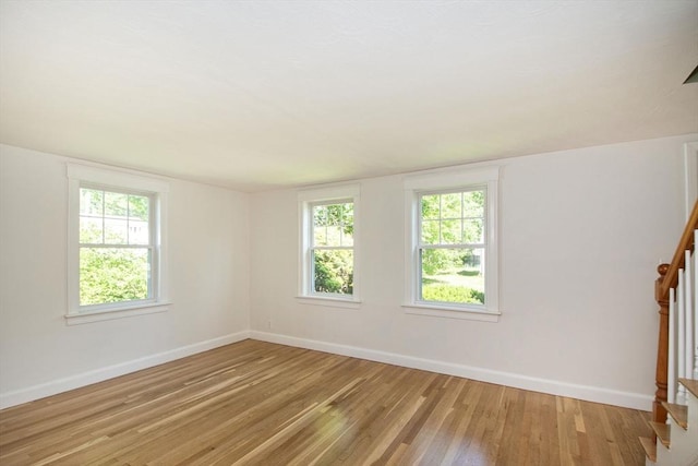 12 Beverly Cir, Randolph, MA 02368 - spare room featuring stairs, light wood-style flooring, and baseboards