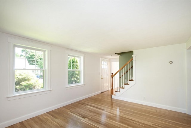 12 Beverly Cir, Randolph, MA 02368 - entryway with baseboards, light wood-style floors, and stairs