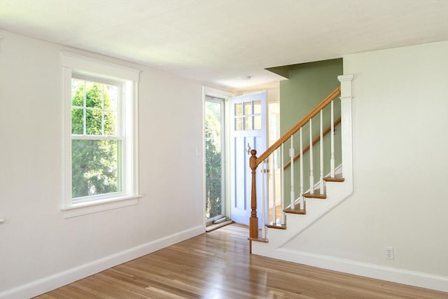 12 Beverly Cir, Randolph, MA 02368 - entryway featuring baseboards, plenty of natural light, and wood finished floors