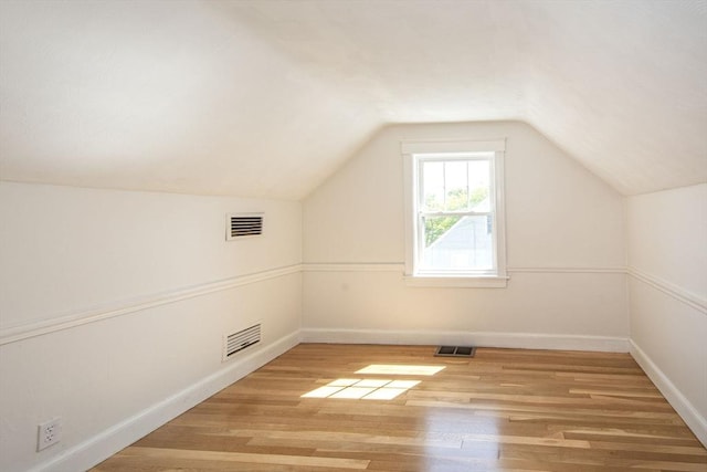 12 Beverly Cir, Randolph, MA 02368 - additional living space with light wood-style floors, baseboards, and lofted ceiling