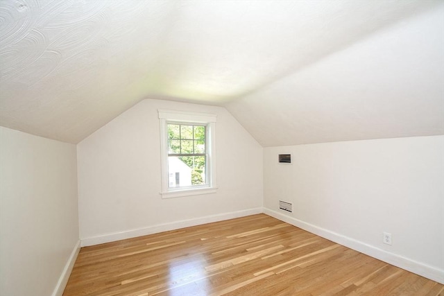 12 Beverly Cir, Randolph, MA 02368 - additional living space featuring baseboards, light wood-type flooring, and vaulted ceiling