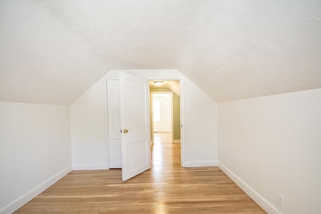 12 Beverly Cir, Randolph, MA 02368 - bonus room featuring light wood-style flooring, baseboards, and vaulted ceiling