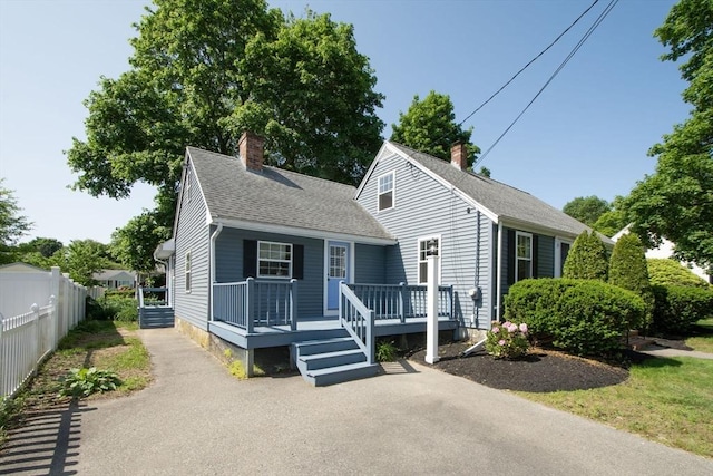 12 Beverly Cir, Randolph, MA 02368 - view of front of house with a chimney and roof with shingles