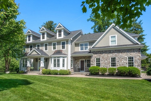 27 Covered Bridge Ln, Wayland, MA 01778 - view of front of house featuring a front lawn and stone siding