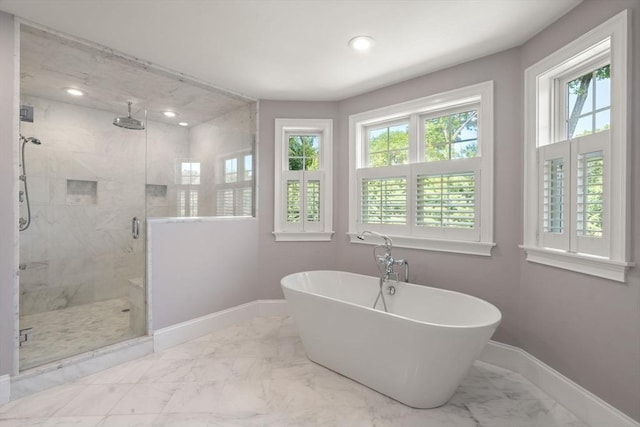 27 Covered Bridge Ln, Wayland, MA 01778 - bathroom featuring marble look tiles, a freestanding tub, baseboards, a marble finish shower, and recessed lighting