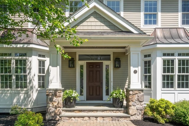 27 Covered Bridge Ln, Wayland, MA 01778 - property entrance featuring covered porch and a standing seam roof
