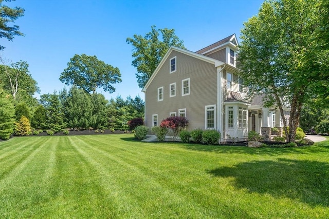 27 Covered Bridge Ln, Wayland, MA 01778 - view of side of home featuring a lawn