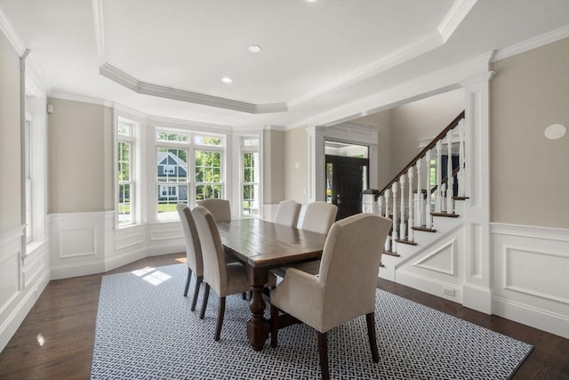 27 Covered Bridge Ln, Wayland, MA 01778 - dining space with wood finished floors, a decorative wall, a tray ceiling, stairway, and crown molding