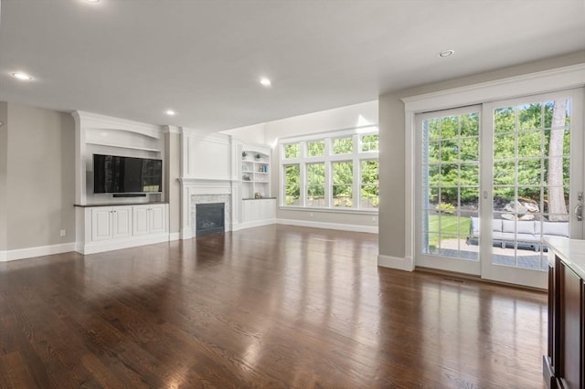 27 Covered Bridge Ln, Wayland, MA 01778 - unfurnished living room featuring baseboards, dark wood finished floors, a fireplace, and recessed lighting