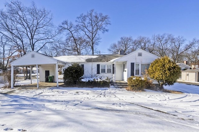 view of front of home featuring a carport