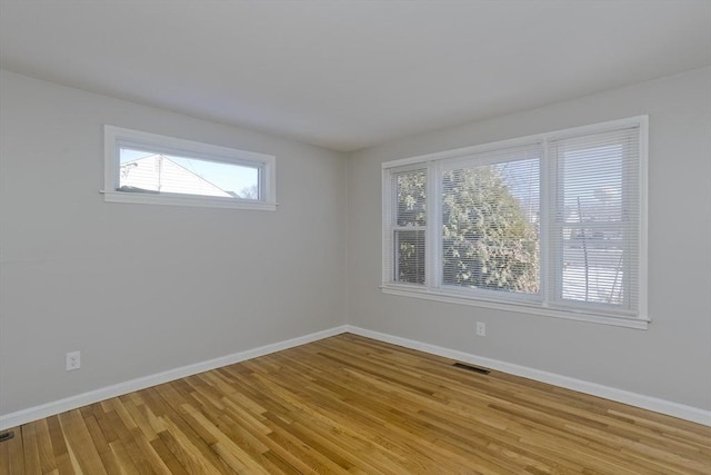 spare room with light hardwood / wood-style floors