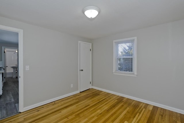 empty room with light hardwood / wood-style floors