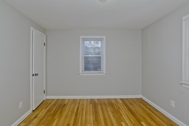 spare room with light wood-type flooring