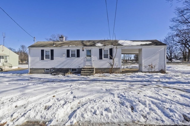 view of snow covered house