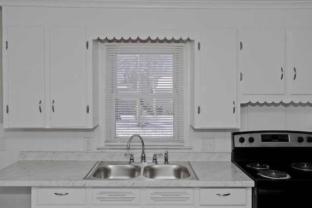 kitchen with white cabinets and stainless steel electric range