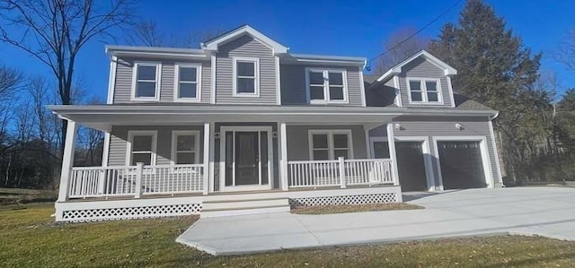 view of front of home with a garage and covered porch