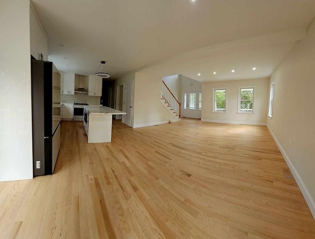 unfurnished living room featuring light wood-type flooring