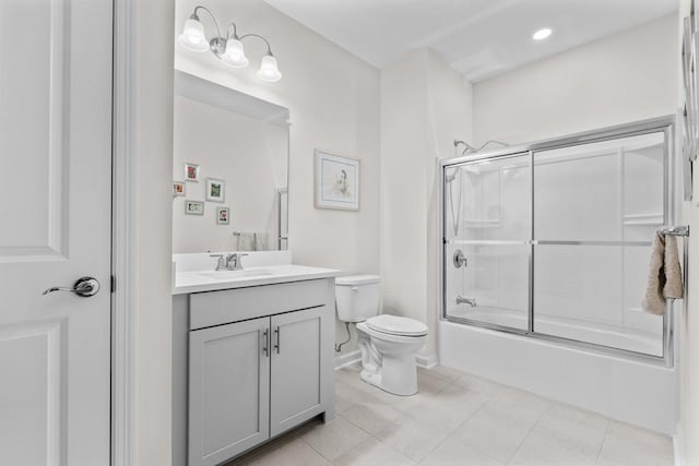 full bathroom featuring tile patterned flooring, vanity, enclosed tub / shower combo, and toilet