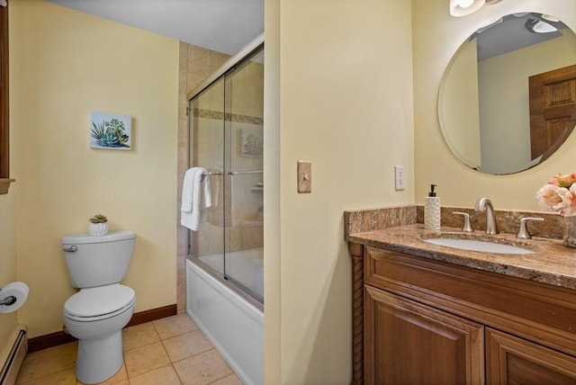bathroom with toilet, baseboard heating, tile patterned floors, vanity, and combined bath / shower with glass door