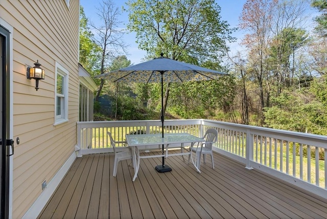 wooden deck with outdoor dining area