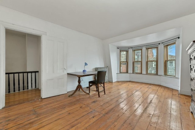 dining space with light hardwood / wood-style flooring