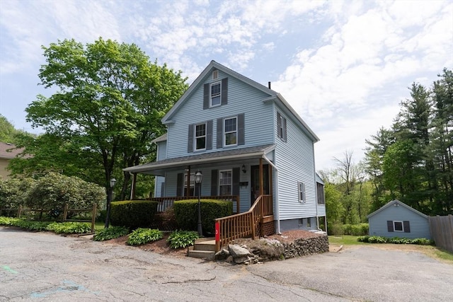 view of front of house featuring a porch and driveway