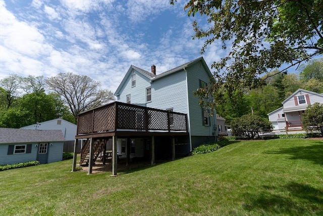 back of property with stairway, a wooden deck, and a chimney