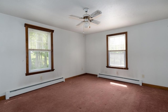 carpeted empty room featuring baseboard heating, a ceiling fan, and baseboards
