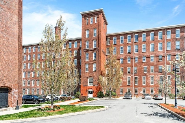 view of property with uncovered parking