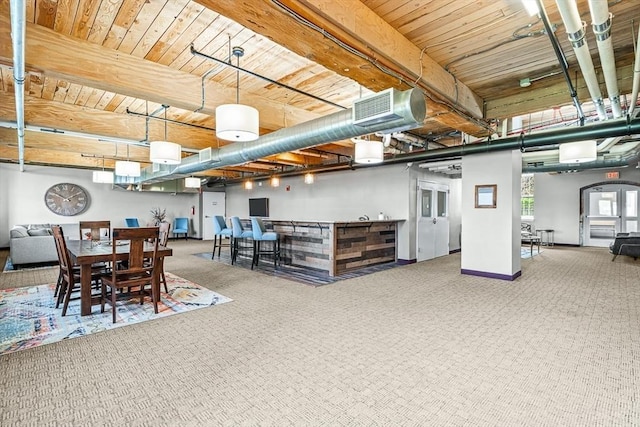 basement with wooden ceiling, carpet floors, and baseboards