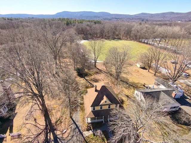 aerial view featuring a mountain view and a forest view