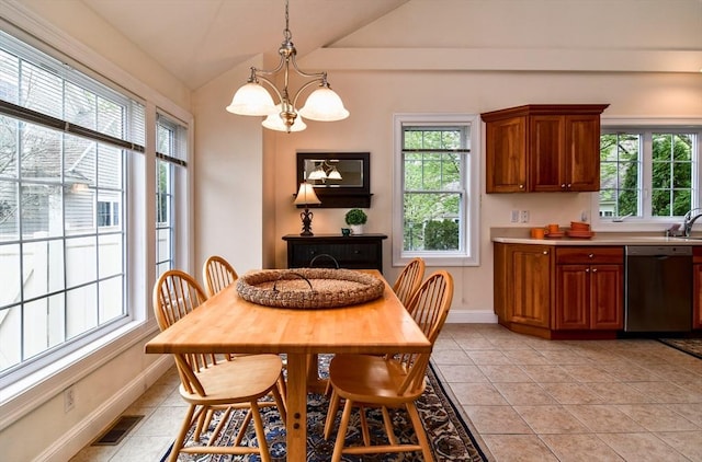 dining space with vaulted ceiling, an inviting chandelier, baseboards, and visible vents