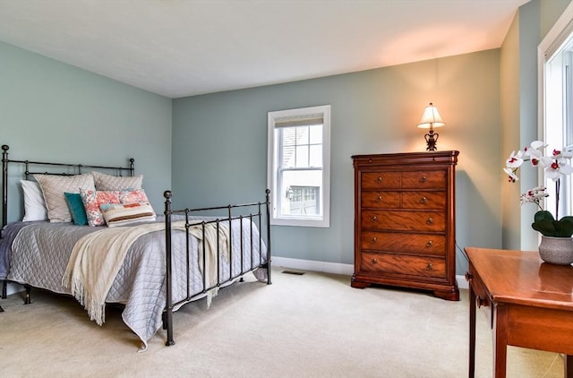 bedroom with visible vents, baseboards, and carpet floors